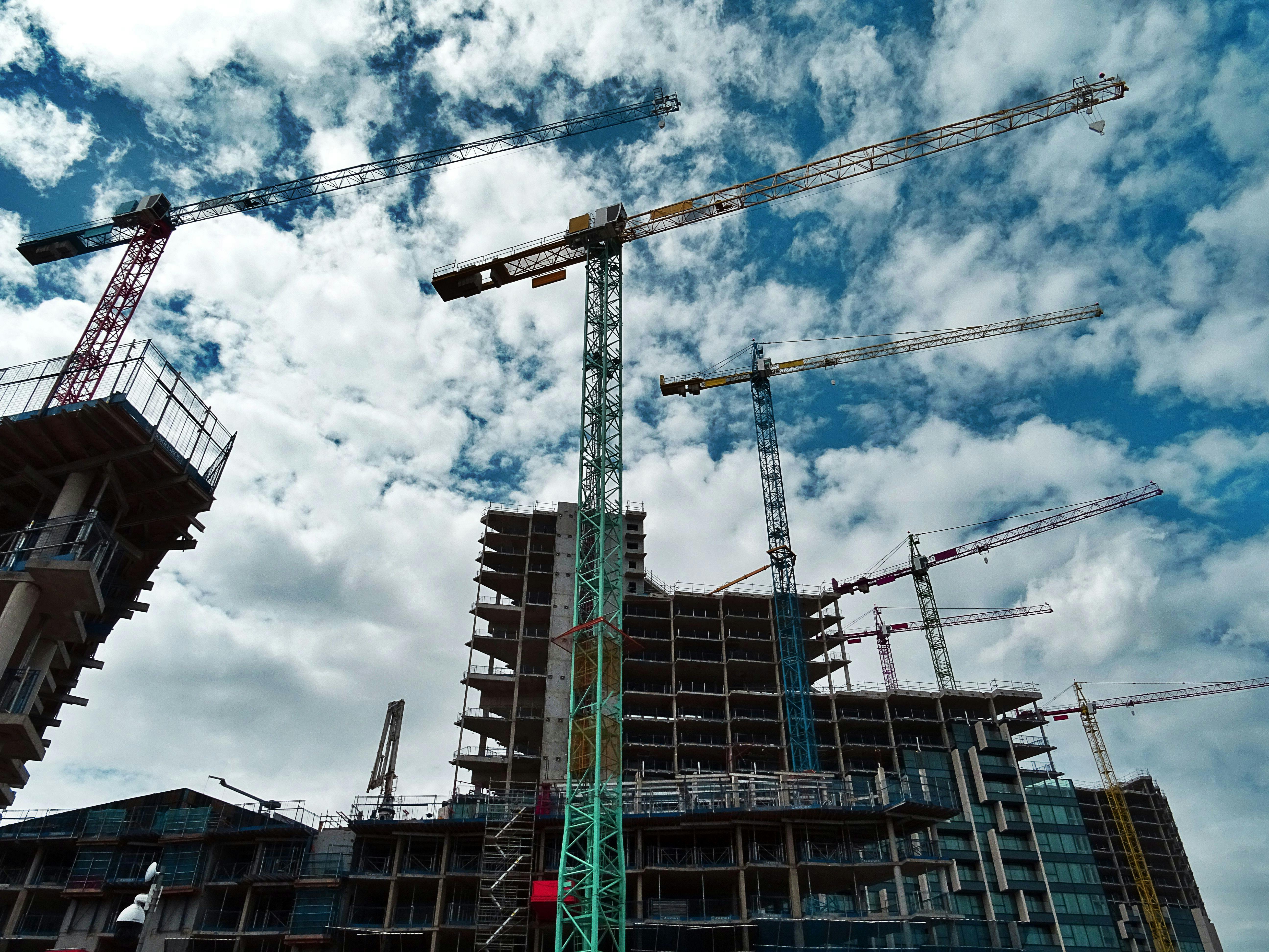 Skyscraper with cranes